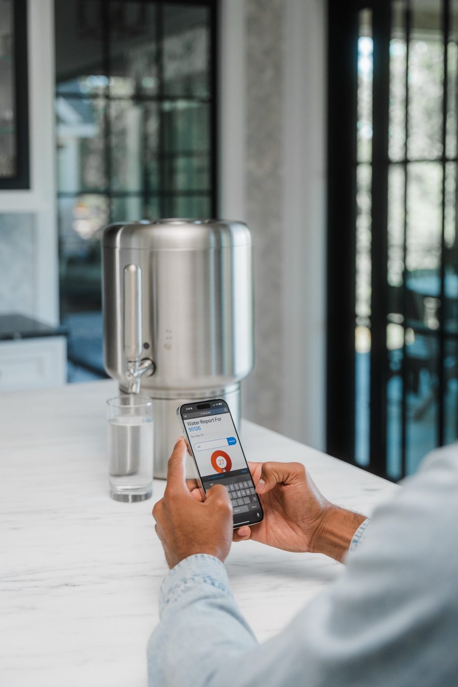 Phone water report beside the Rorra Countertop system